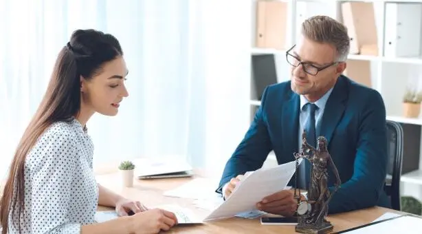 Lawyer and client reviewing documents during consultation